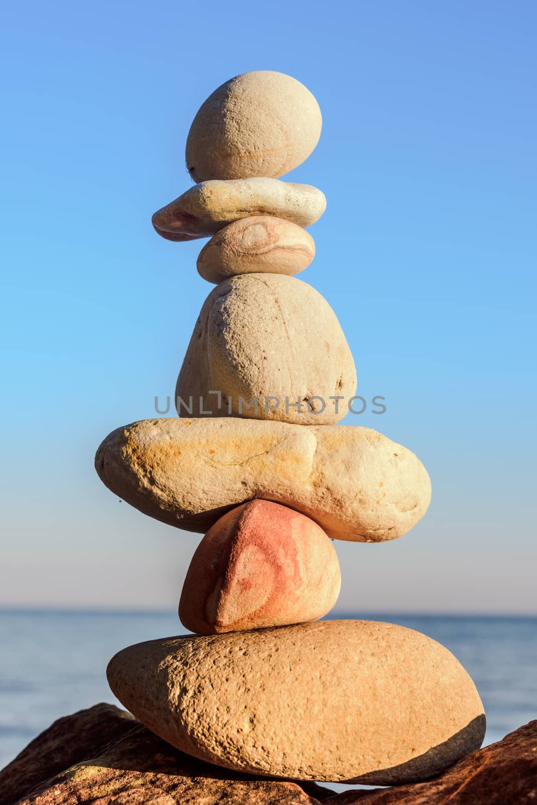 Balancing of stones each other on the seashore