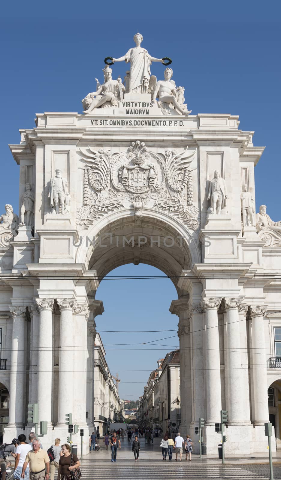 LISBON, PORTUGAL - SEPTEMBER 26, 2015: unidentified people walking at Rua Augusta arch in  Lisbon on September 26, 2015. Lisbon is a capital and must famous city of Portugal