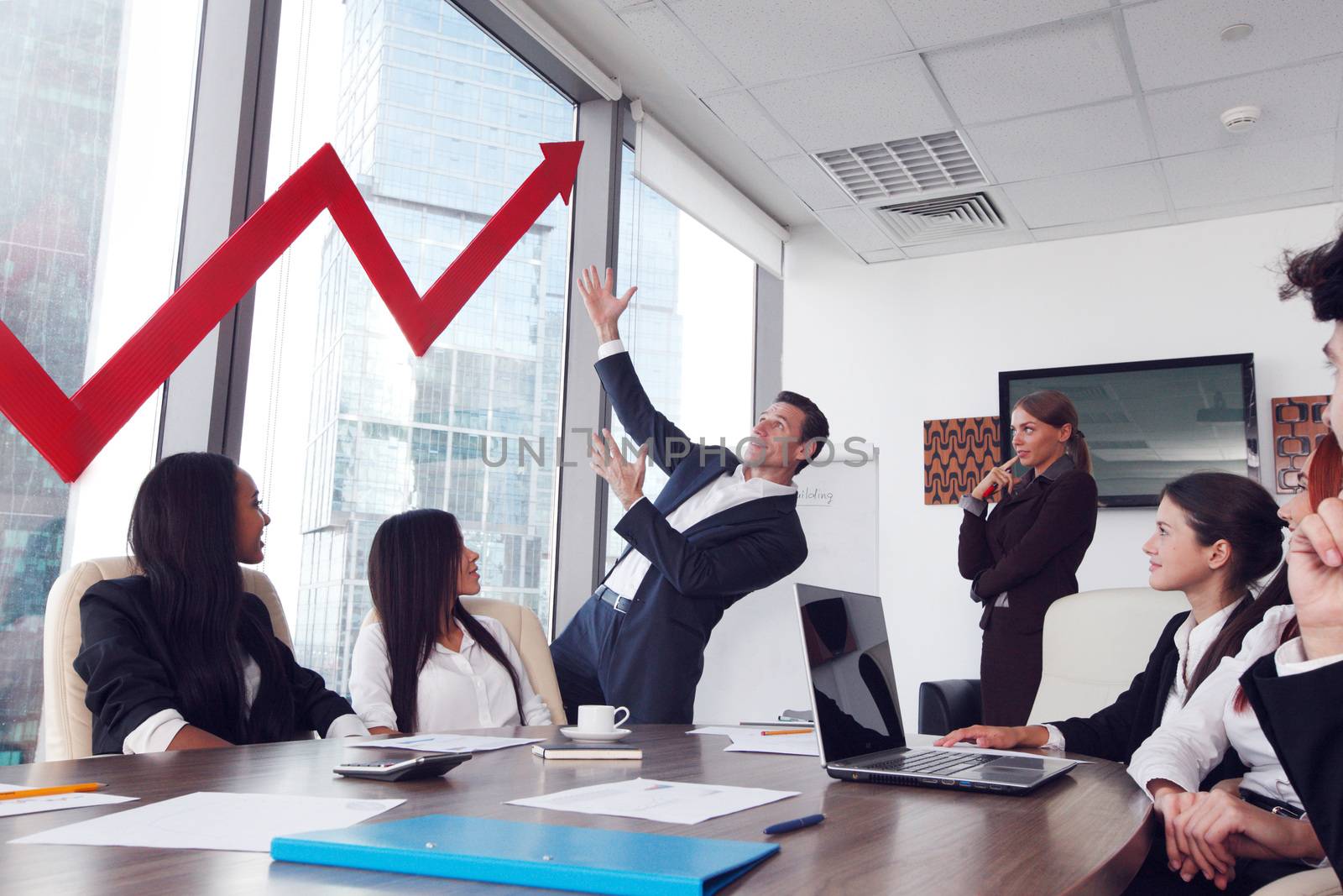 Business people discuss red arrow of income growth at meeting