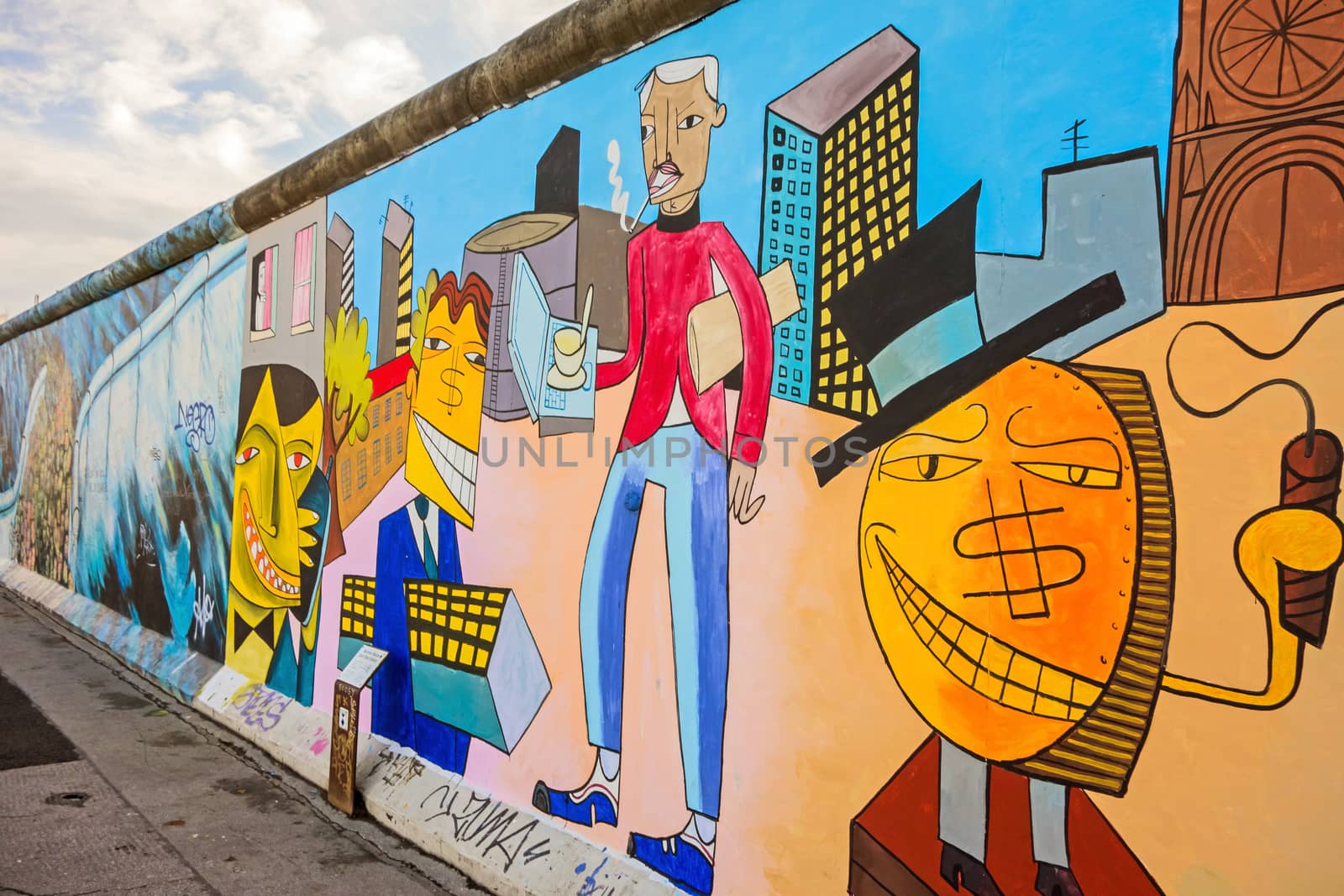 Berlin, Germany - October 26, 2013: East Side Gallery - an international memorial for freedom. Former Berlin Wall - a barrier within Germany, dividing the country.