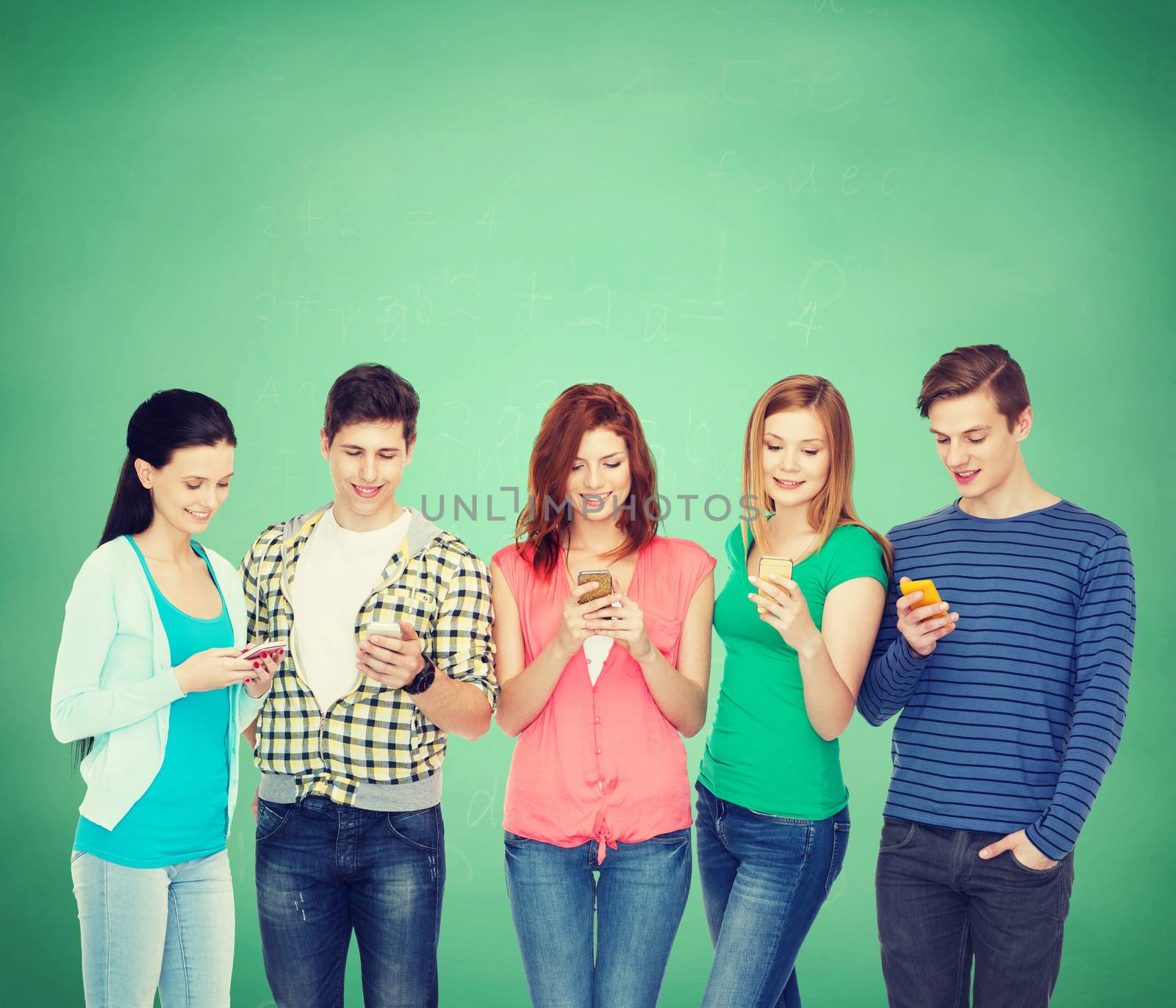 education and modern technology concept - smiling students with smartphones