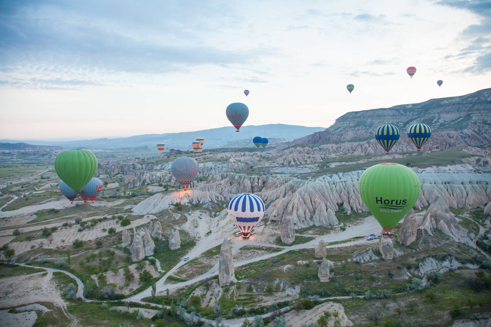 hot air balloons cruising in air by haiderazim