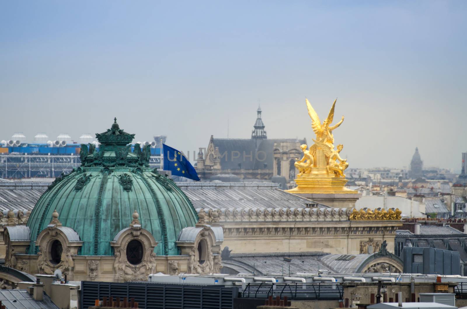 Golden sculpture with beautiful Paris skyline by siraanamwong