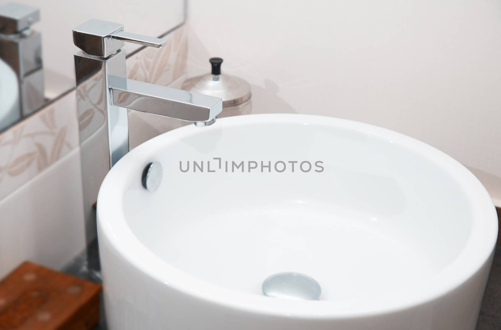 Sink and water tap. Horizontal close-up photo