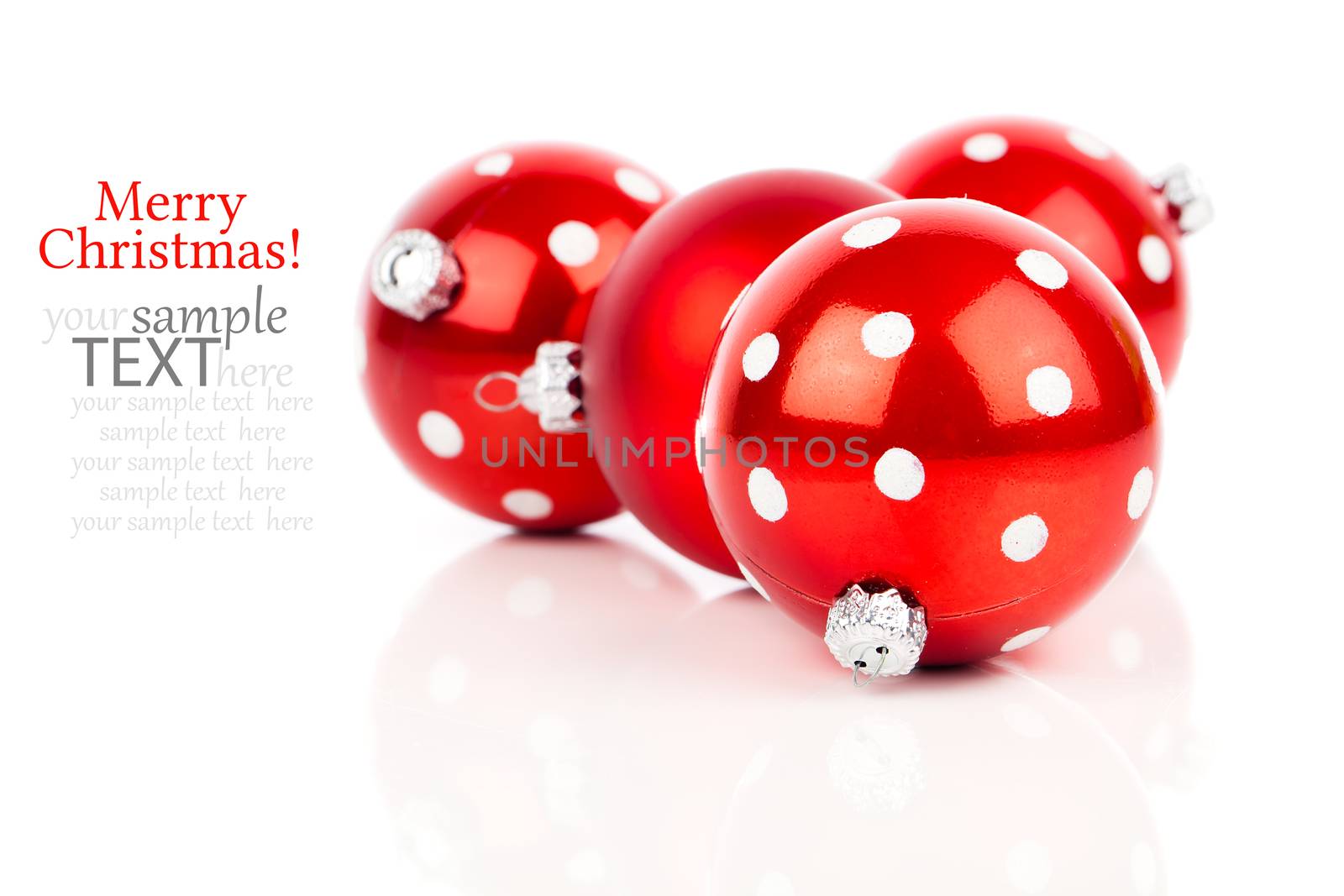 red polka dot Christmas bauble, isolated over white by motorolka