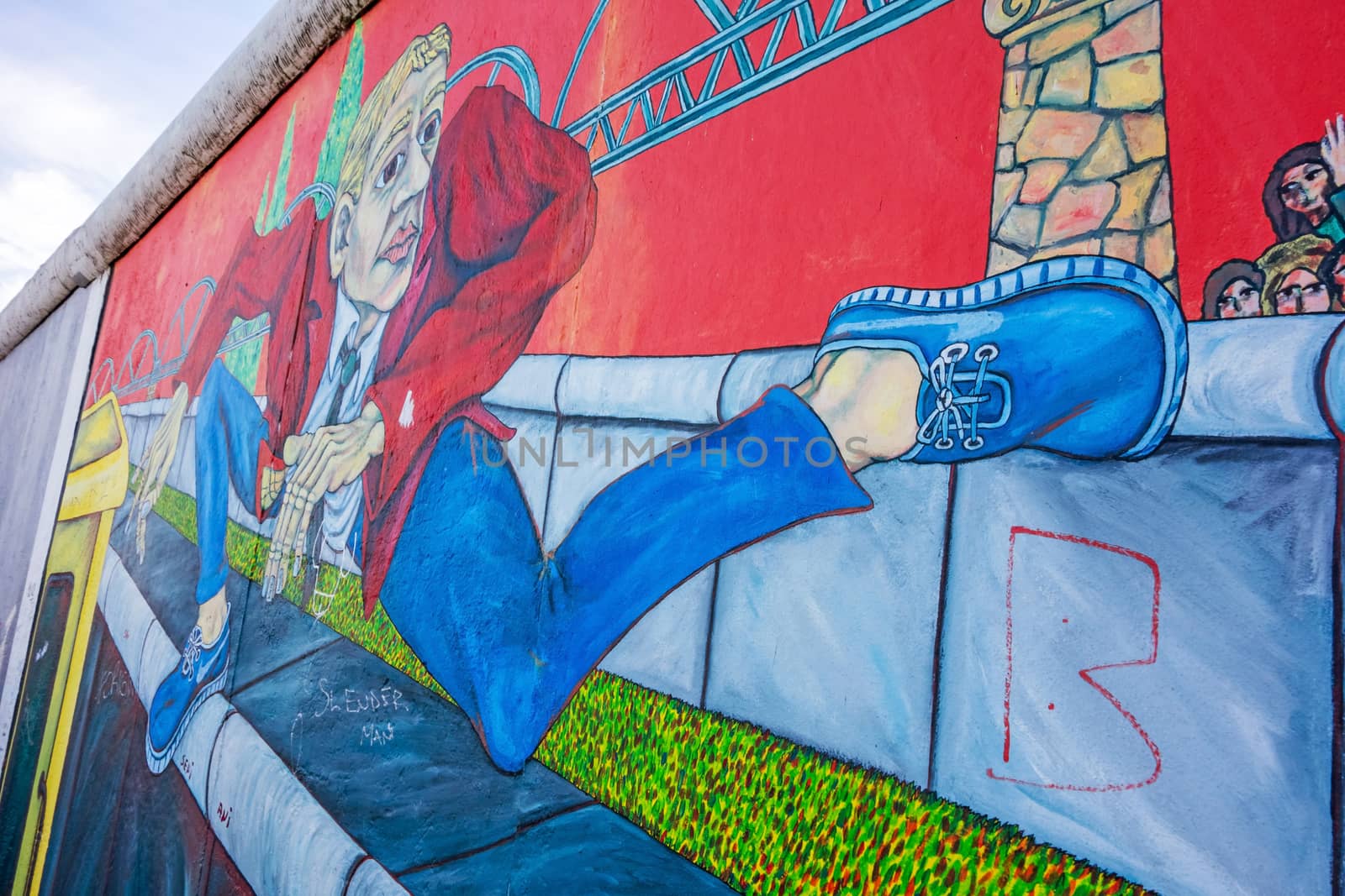 Berlin, Germany - October 26, 2013: East Side Gallery - an international memorial for freedom. Former Berlin Wall - a barrier within Germany, dividing the country.