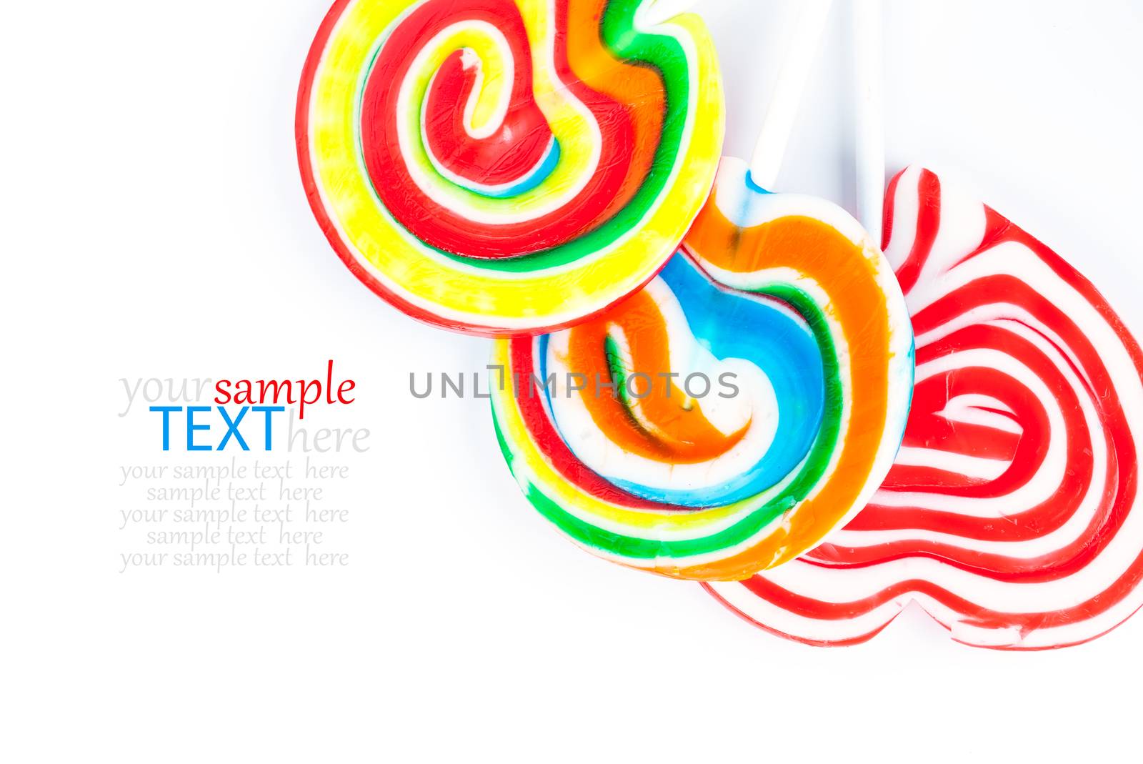 Colorful lollipops isolated on white by motorolka