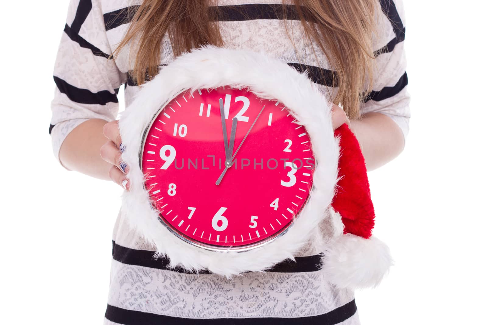 Big clocks a Christmas hat in female hands. New Year. 12 hours by victosha
