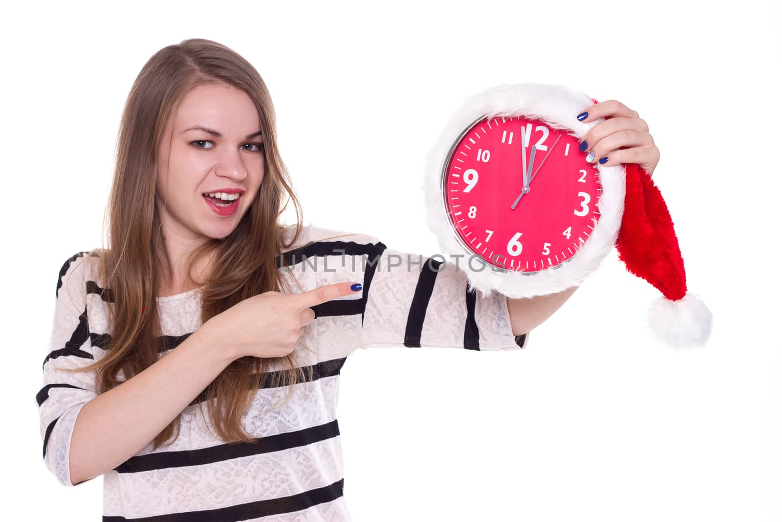 young woman in santa hat with clock posing isolated  by victosha