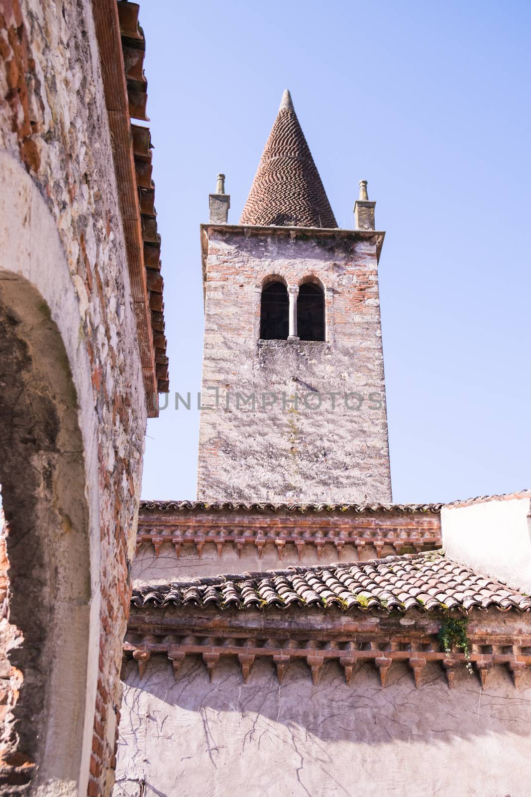 ancient bell tower in a medieval village in Italy