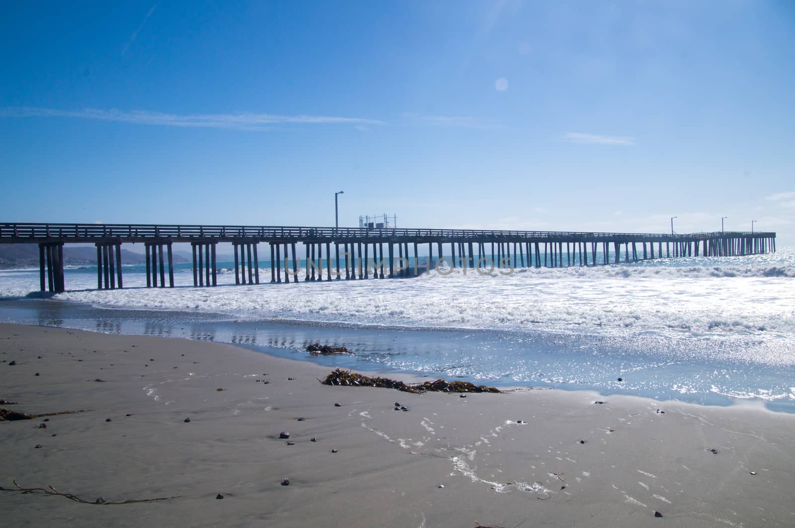 Sunshine on the empty pier at California coast