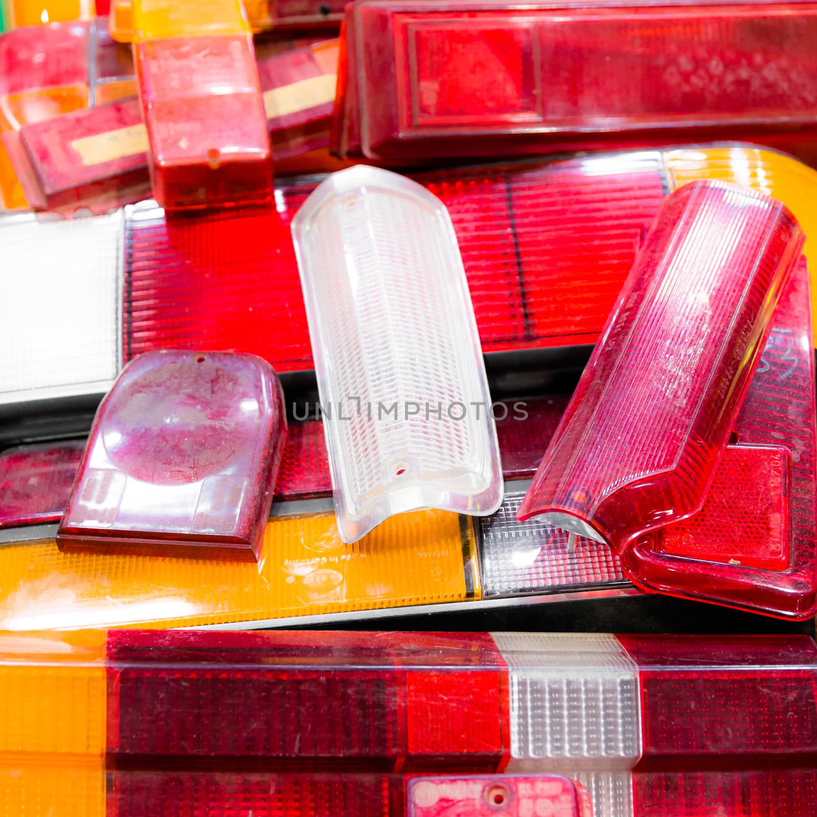 composition with different types of vintage rear lights of car.