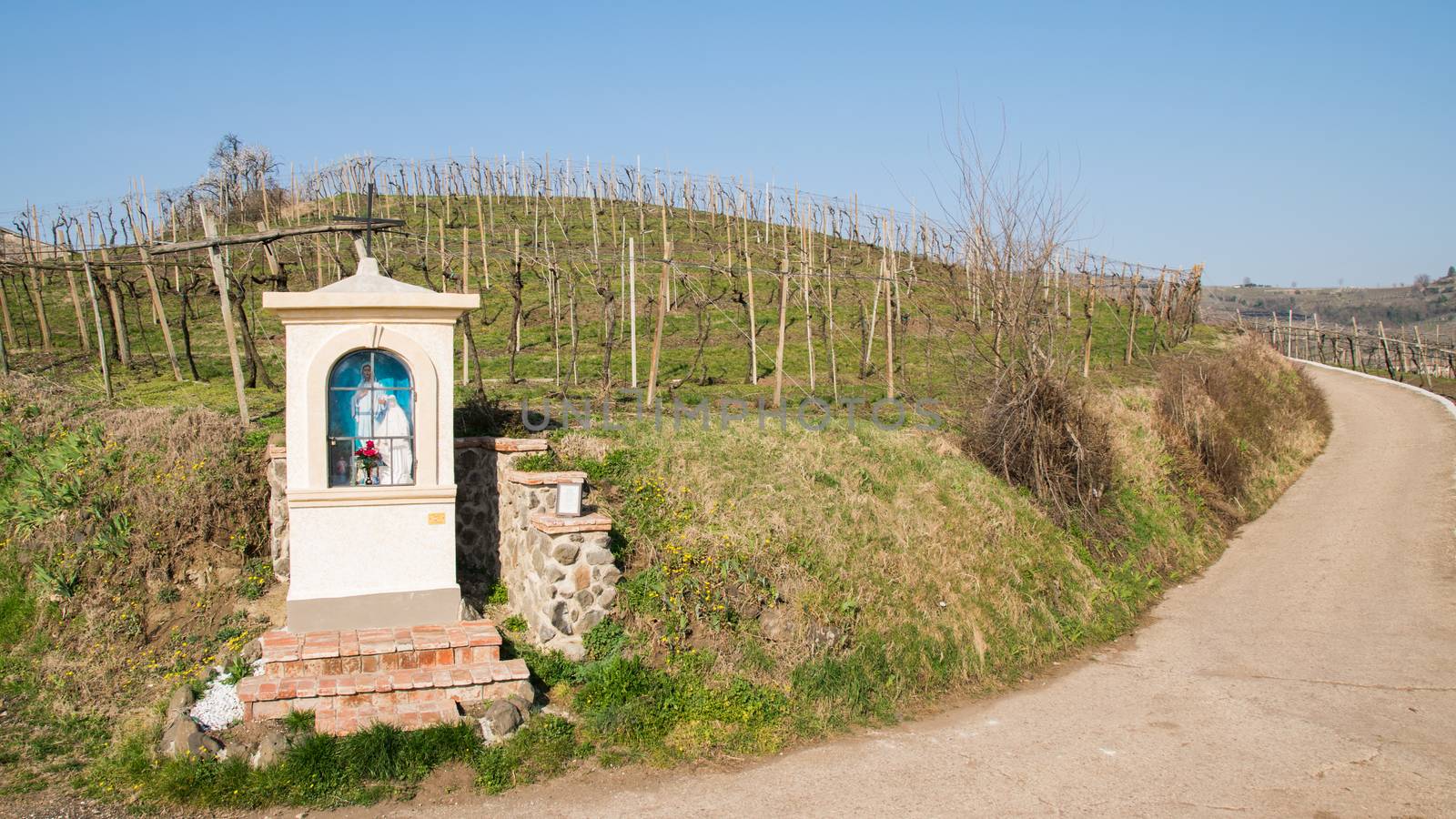 Italian traditional votive temple in the countryside dedicated to the Virgin Mary to propitiate the harvest