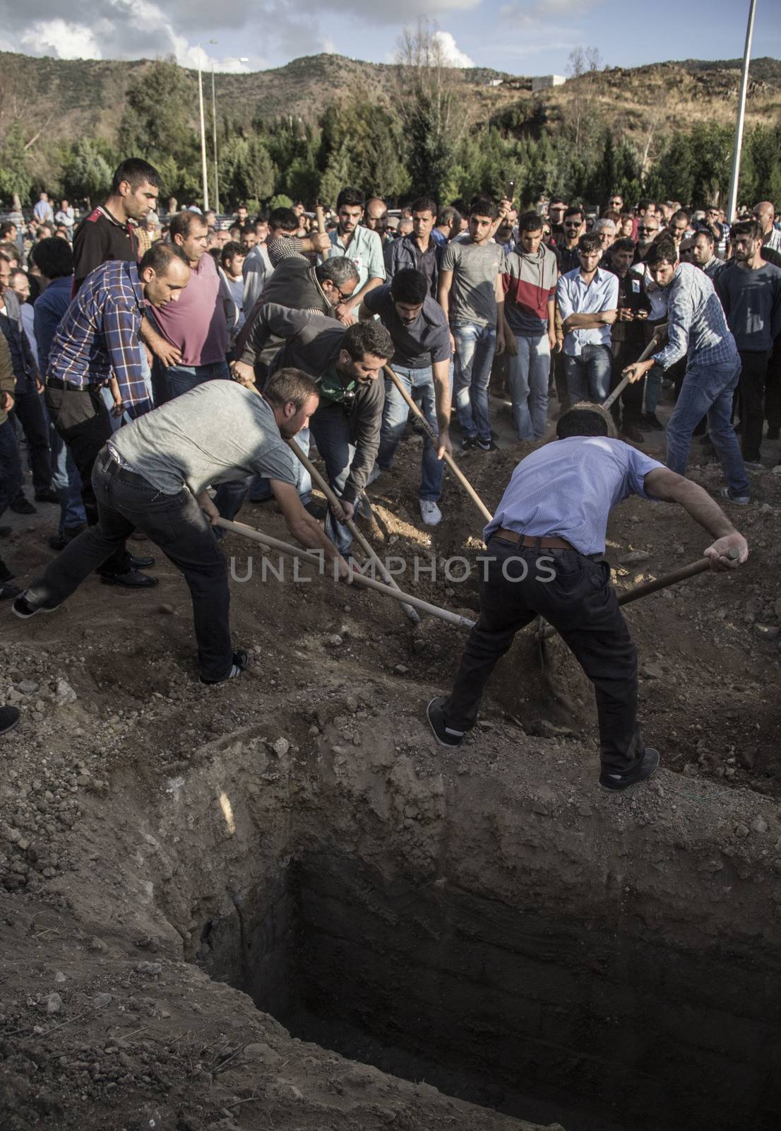 TURKEY, Izmir: Around a thousand people turned out to pay their respects on October 11, 2015 at the funerals of two people who died in the Ankara bombings. Berna Koc, a student and Ayse Deniz, a local leader of the pro-Kurdish People's Democratic Party (HDP) were laid to rest in their home town of Izmir. 