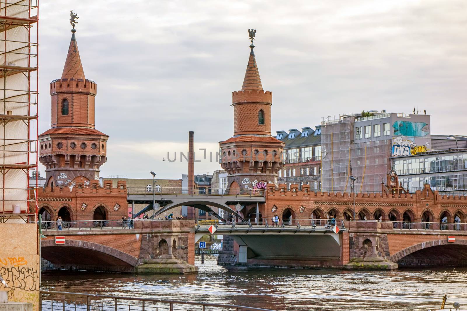 Berlin, Germany - October 26, 2013: Bridge Oberbaumbruecke - an international memorial for freedom. Former Berlin Wall - a barrier within Germany, dividing the country.