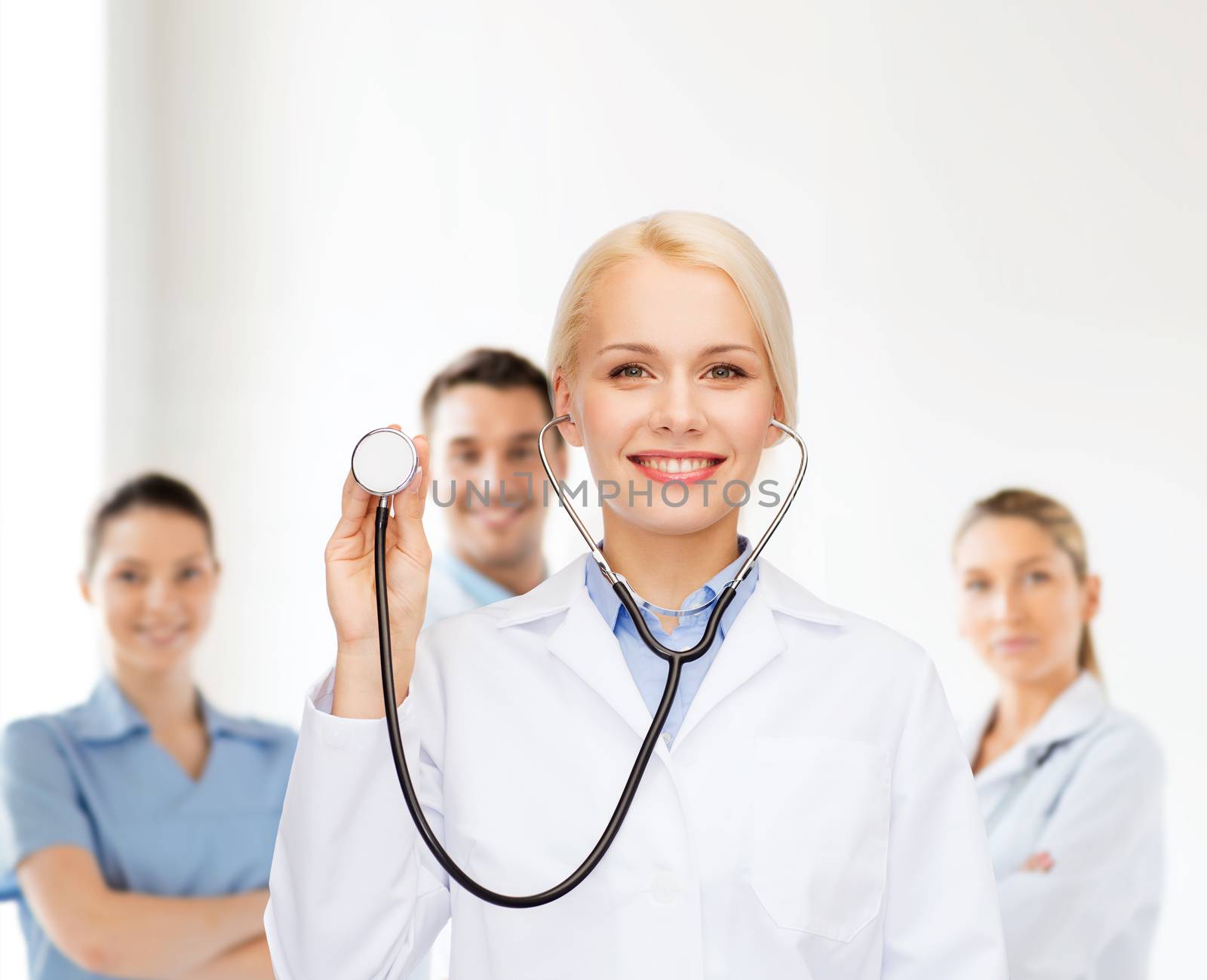 healthcare and medicine concept - smiling female doctor with stethoscope