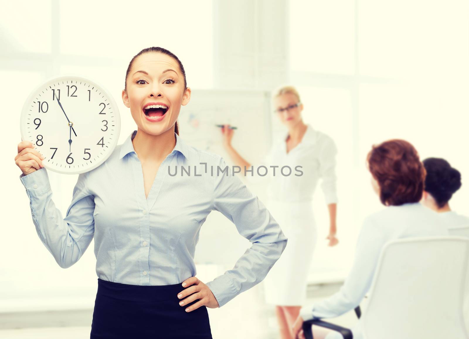 attractive businesswoman with wall clock by dolgachov