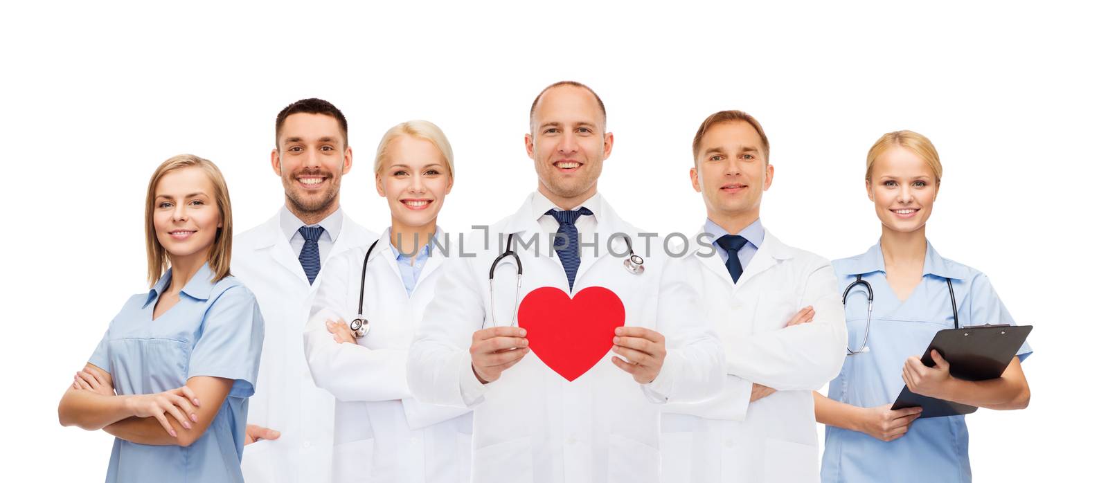 medicine, profession, teamwork and healthcare concept - group of smiling medics or doctors holding red paper heart shape, clipboard and stethoscopes over white background