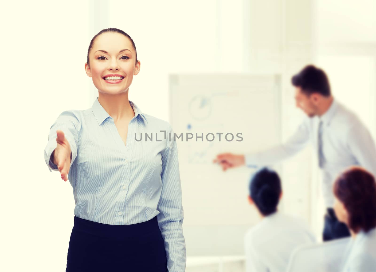 businesswoman with opened hand ready for handshake by dolgachov