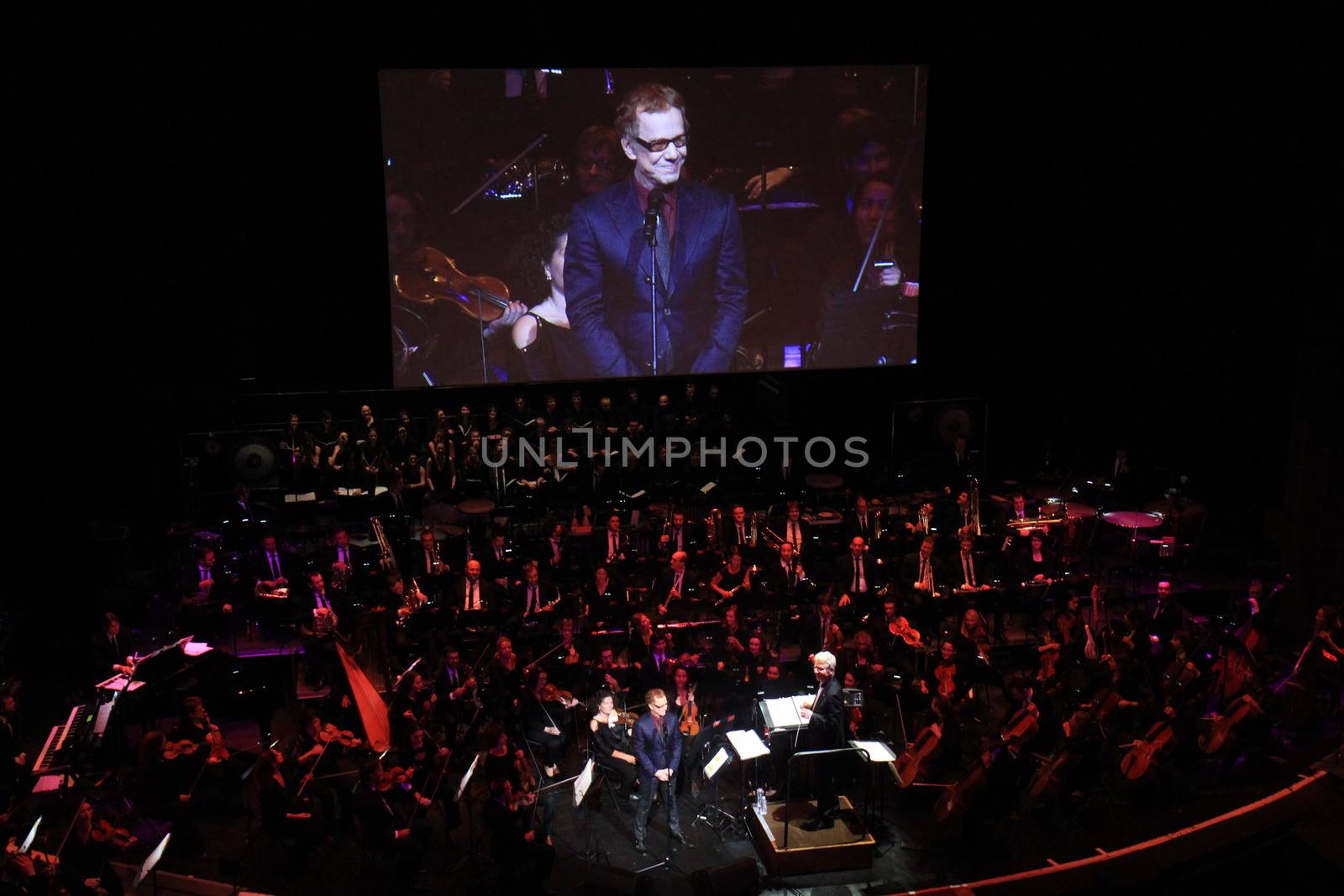 FRANCE, Paris: American composer Danny Elfman and the Lamoureux orchestra perform on the stage of the Grand Rex, in Paris, during the show Danny Elfman's music from the films of Tim Burton, on October 10, 2015.