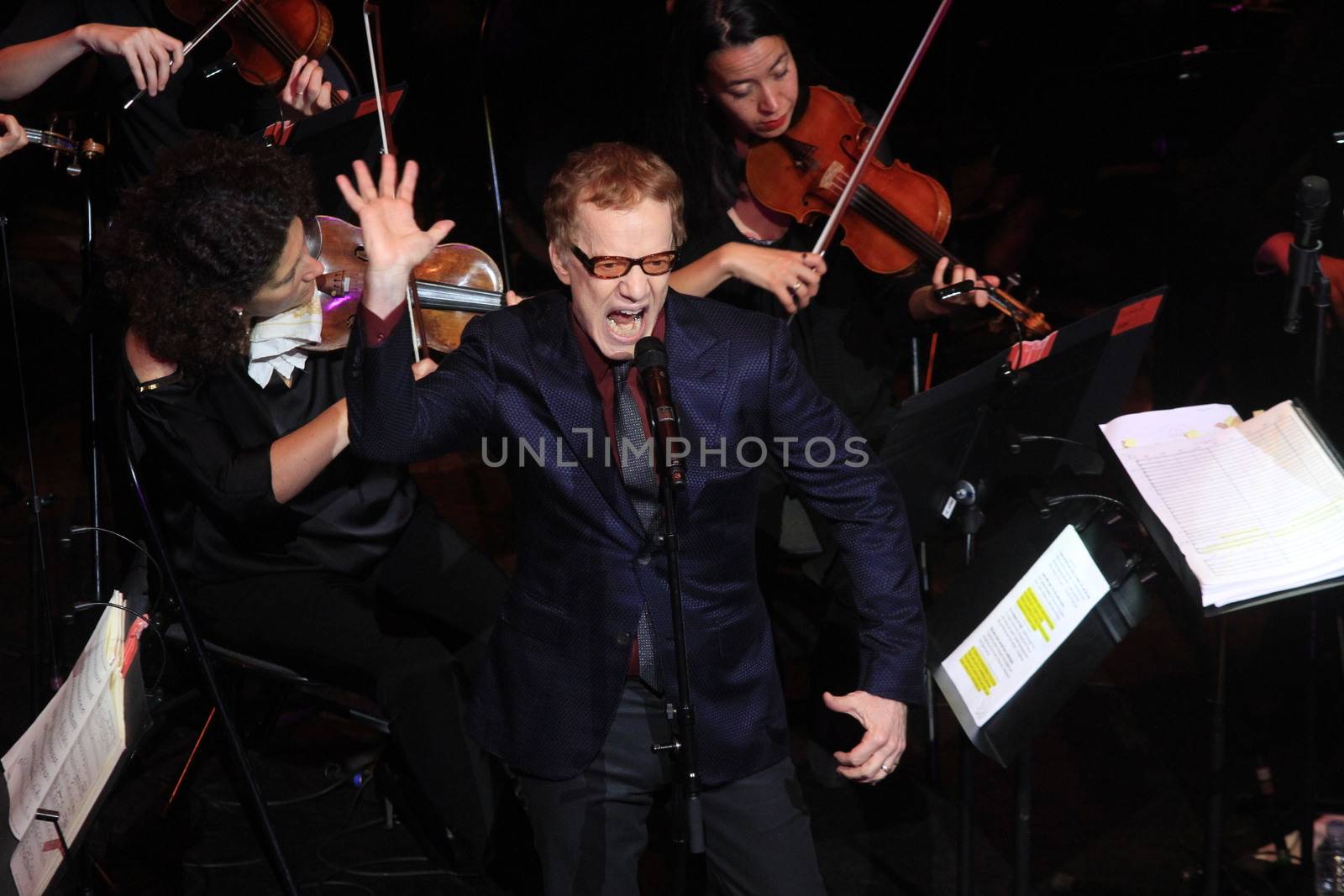 FRANCE, Paris: American composer Danny Elfman and the Lamoureux orchestra perform on the stage of the Grand Rex, in Paris, during the show Danny Elfman's music from the films of Tim Burton, on October 10, 2015.