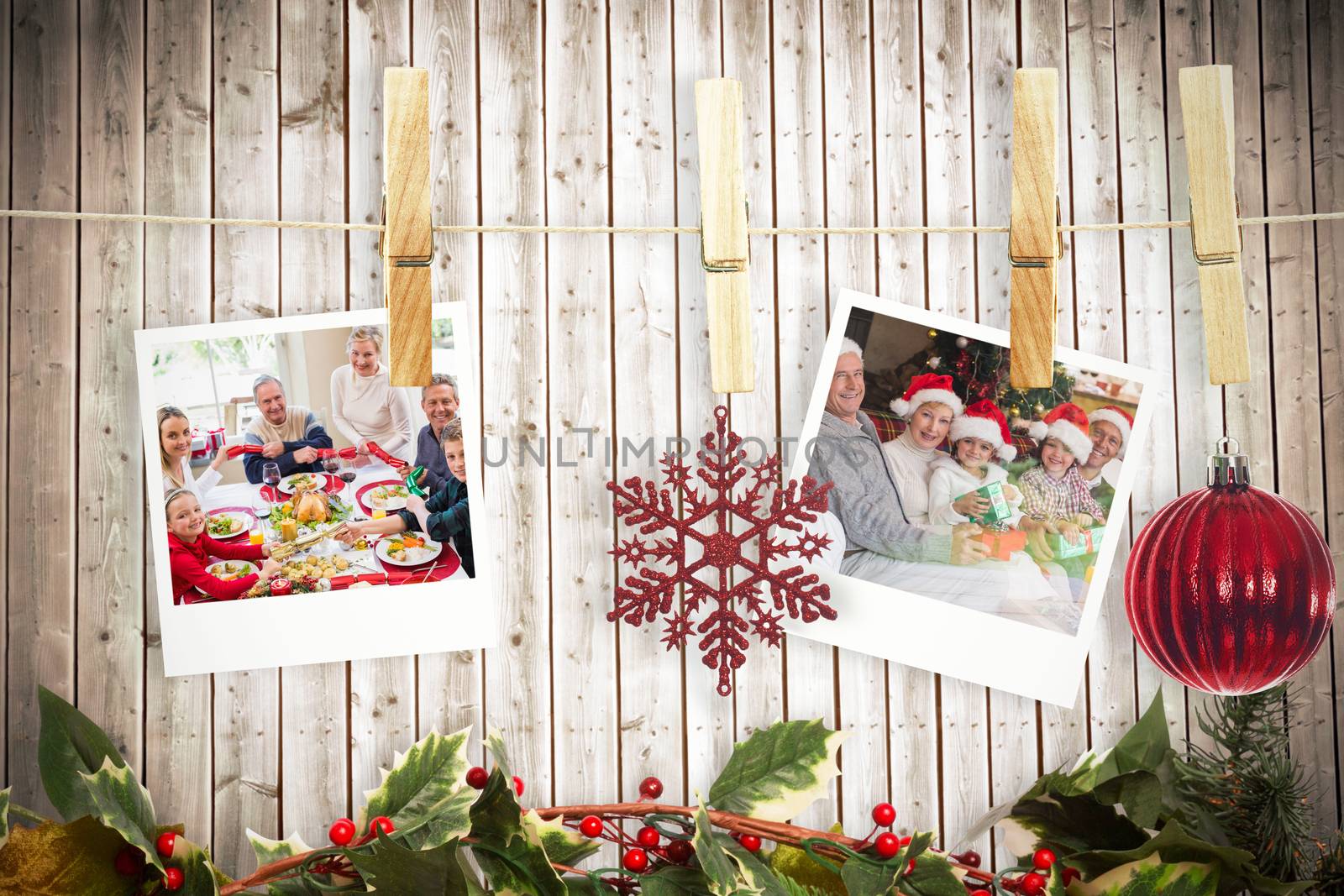 Composite image of hanging christmas photos by Wavebreakmedia