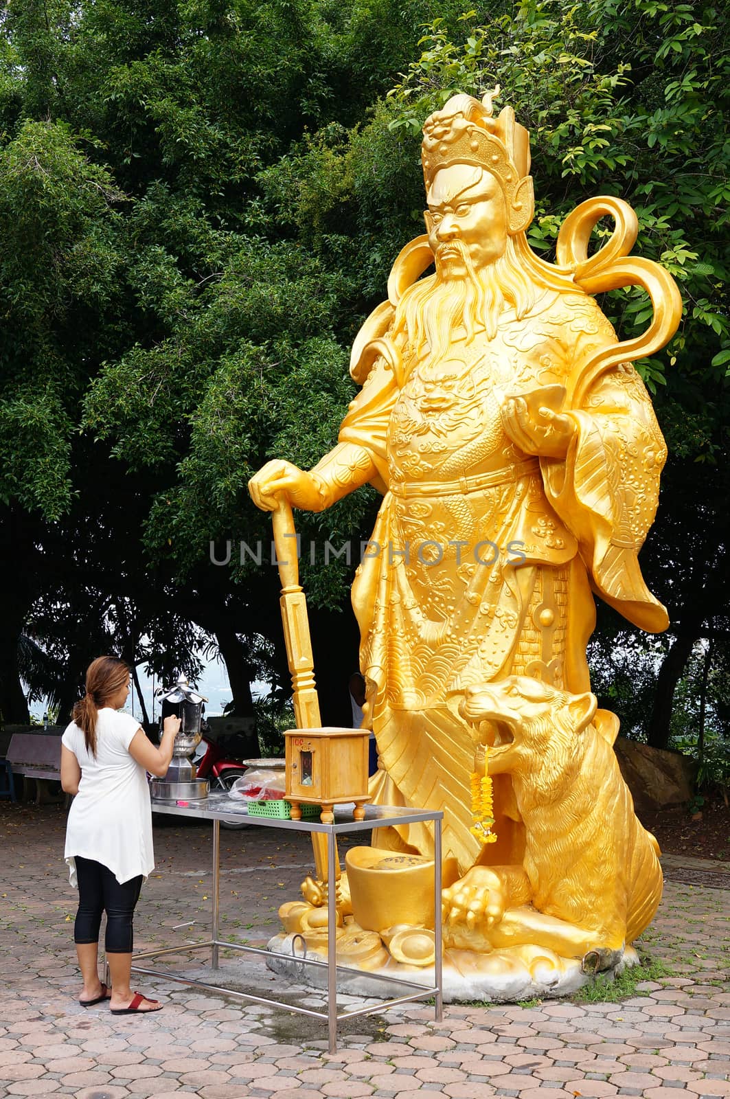 Hat Yai, Thailand -  13 Sept, 15 :Golden buddha was blessing people for safety and smoothly. Goddess of  Compassion &amp; Mercy is located on top of a hill at Hat Yai Municipal Park. It is about 1000 steps to the hilltop where there is 360 degree panoramic view of Hat Yai City and Songkhla.