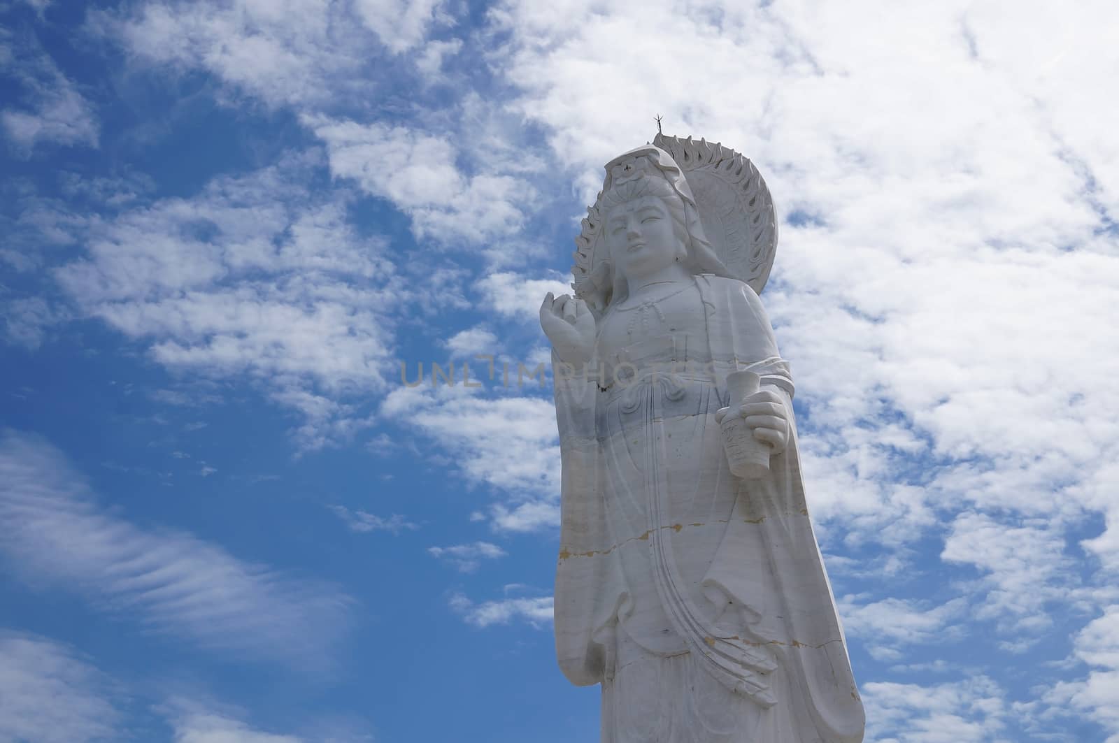 Hat Yai, Thailand -  13 Sept, 15 : The 20 metres high white jade statue of  Kuan Yin,  Goddess of  Compassion & Mercy is located on top of a hill at Hat Yai Municipal Park. It is about 1000 steps to the hilltop where there is 360 degree panoramic view of Hat Yai City and Songkhla.