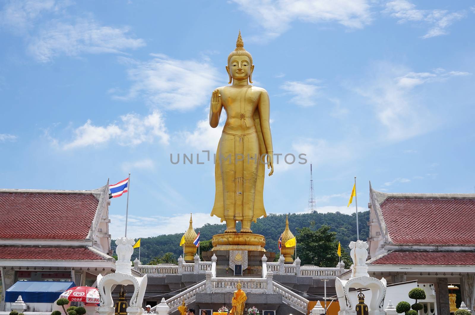 Hat Yai, Thailand -  13 Sept, 15 :  It is around 20 meters weighs 200 tons and was made in 1999 to celebrate the King of Thailand's 6th Cycle Birthday Celebration which was his 72nd birthday. With His right had raised with forefinger and thumb touching each other, this mudra denotes 'Intelligence, Intellect and Integrity'. Hat Yai Observatory is Hat Yai's deep sky observation for science and astronomy. Located in the vicinity of this temple.