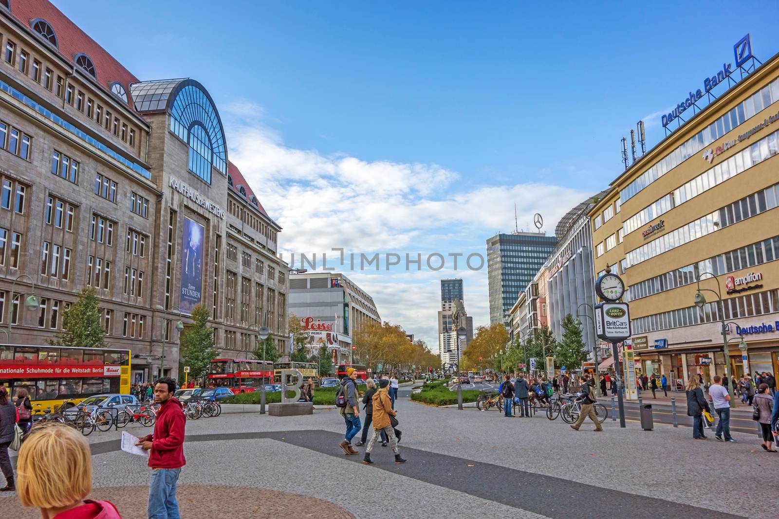 Berlin, Germany - October 27, 2013: View from Wittenbergplatz square towards church Kaiser-Wilhelm-Ged�chtnis-Kirche - famous shopping mall KaDeWe on the left.