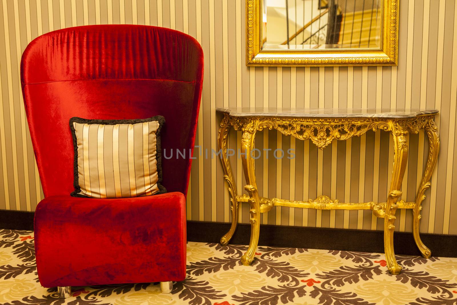 Royal Armchair in red in warm athmosphere decoration by juniart