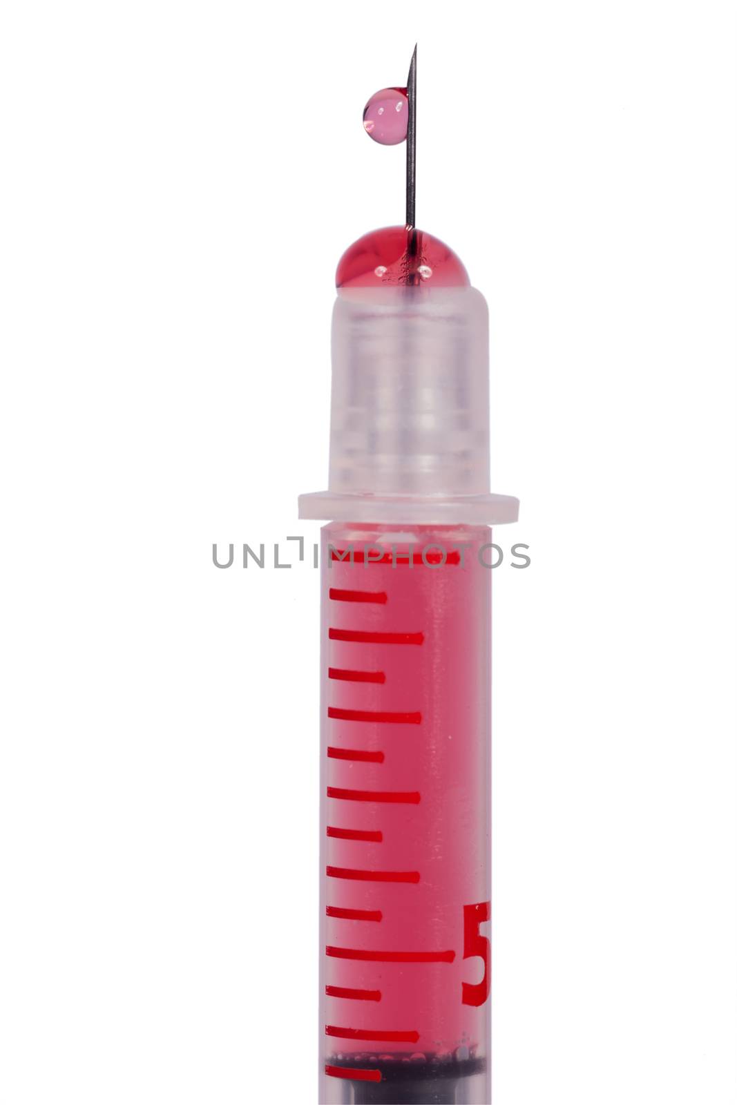 Disposable plastic hypodermic syringe and needle filled with a red solution for administering drugs subcutaneously or intramuscular isolated on white