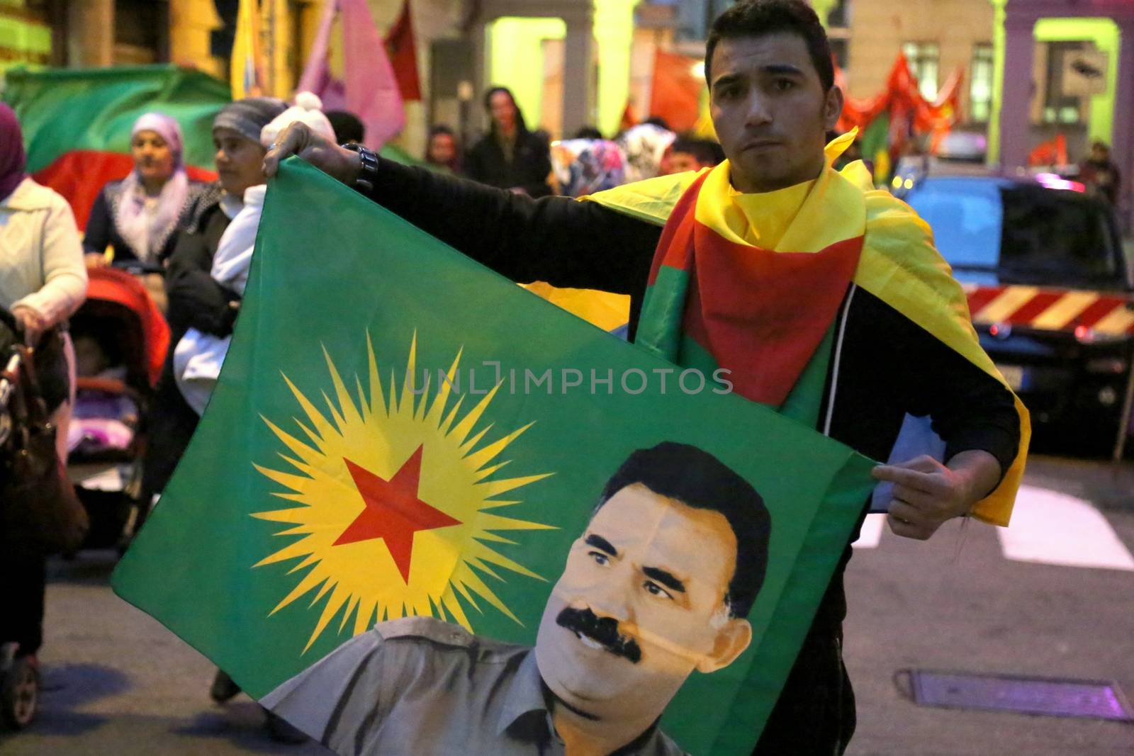 ITALY, Turin: A boy holds an image of Turkish President Recep Tayyip Erdogan as thousands march through Turin, Italy on October 13, 2015. They rally to show solidarity with the people of Turkey, after the weekend's bombings in Ankara that left at least 97 dead. Demonstrators protest against the Turkish government, blaming the administration for the attack. Some Kurdish and leftist activists have asserted that these bombings were perpetrated in part by Turkey's governing AKP administration, intended as a blow to the pro-Kurdish HDP opposition ahead of the snap parliamentary elections in November. 