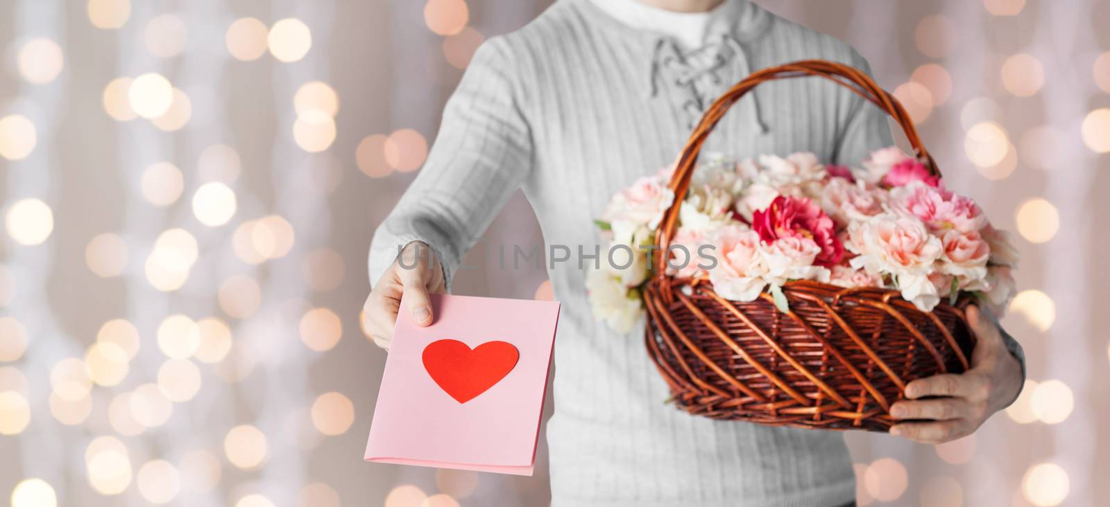 man holding basket full of flowers and postcard by dolgachov