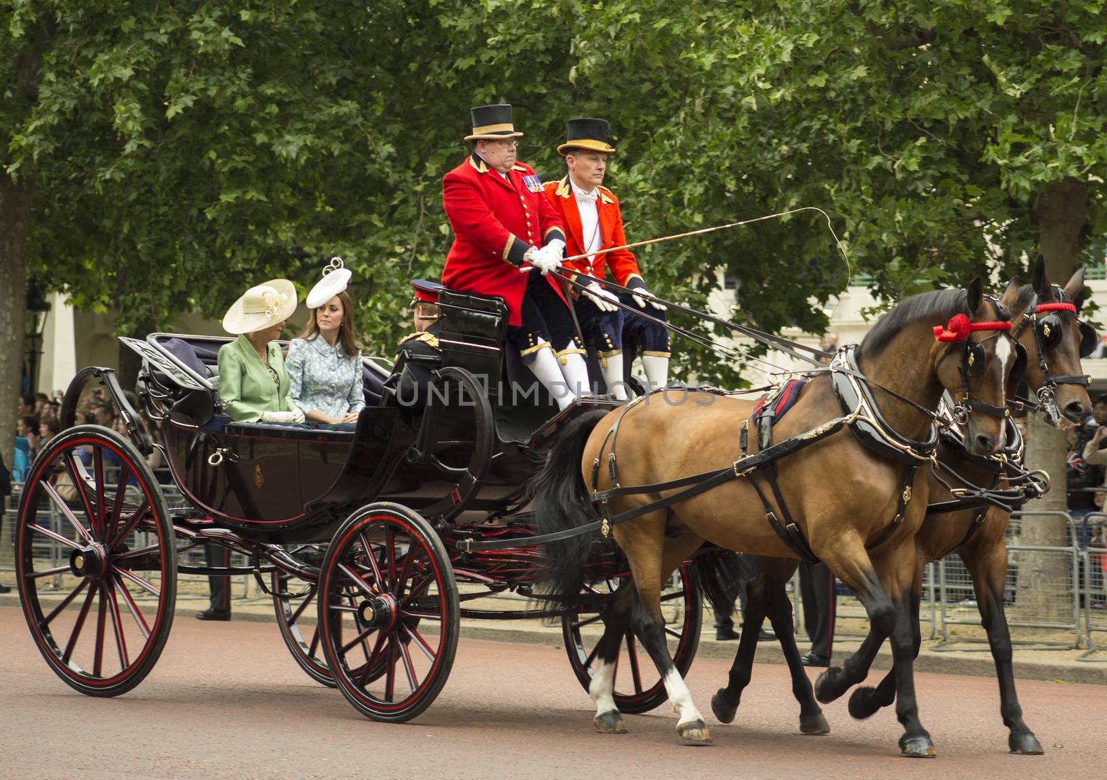 London, England - June 13, 2015: Kate, Duchess of Cambridge, in an open carriage with Camilla, Duchess of Cornwall, and Prince Harry for trooping the colour 2015.