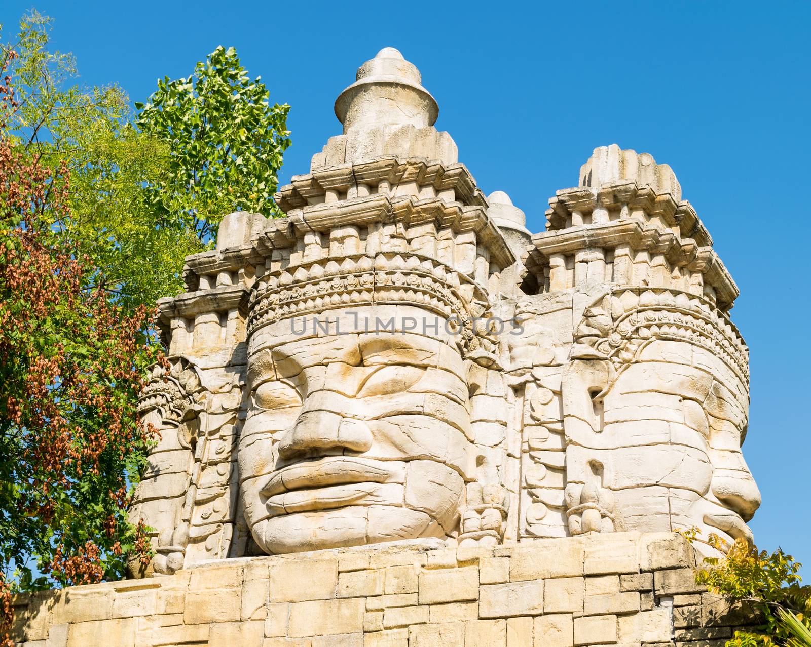 Stone faces of a temple. by Isaac74