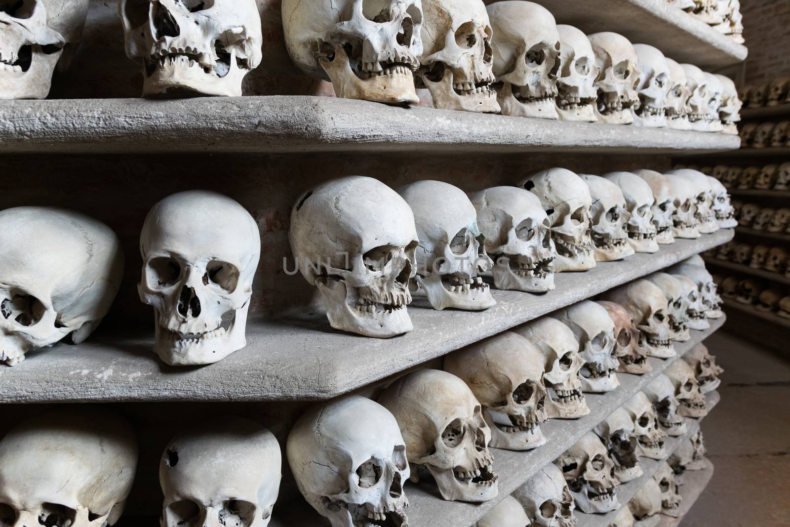 Human skulls inside a catacomb. by Isaac74