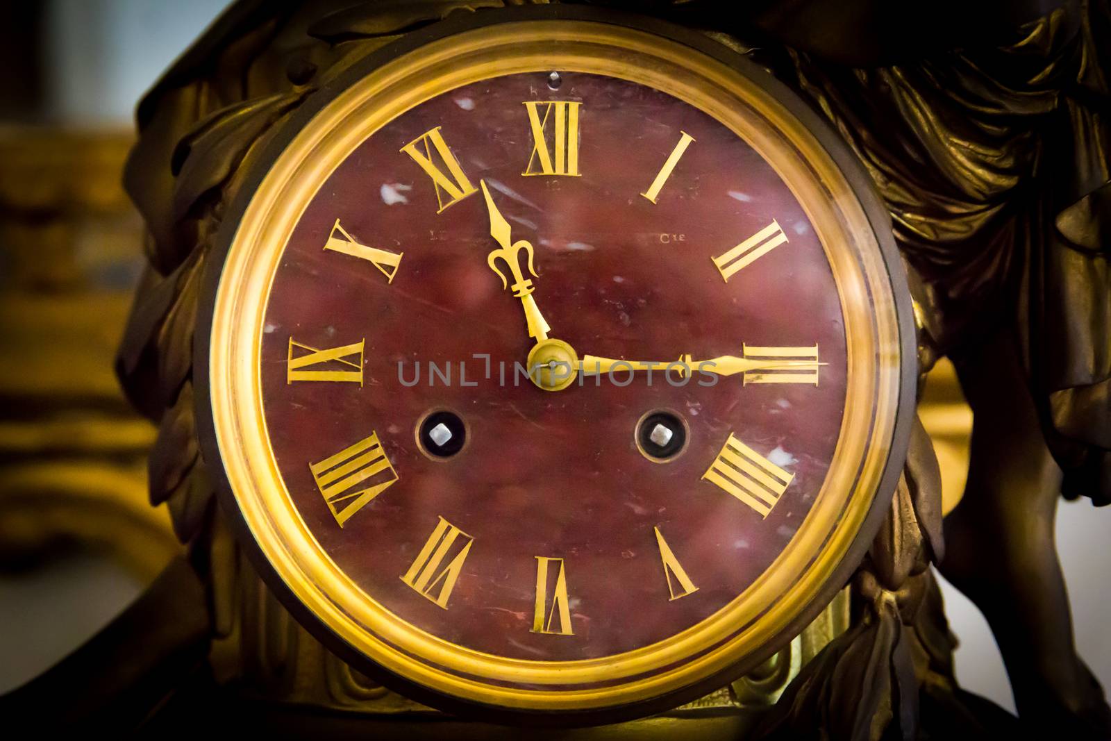 detail of antique table clock with manual winding