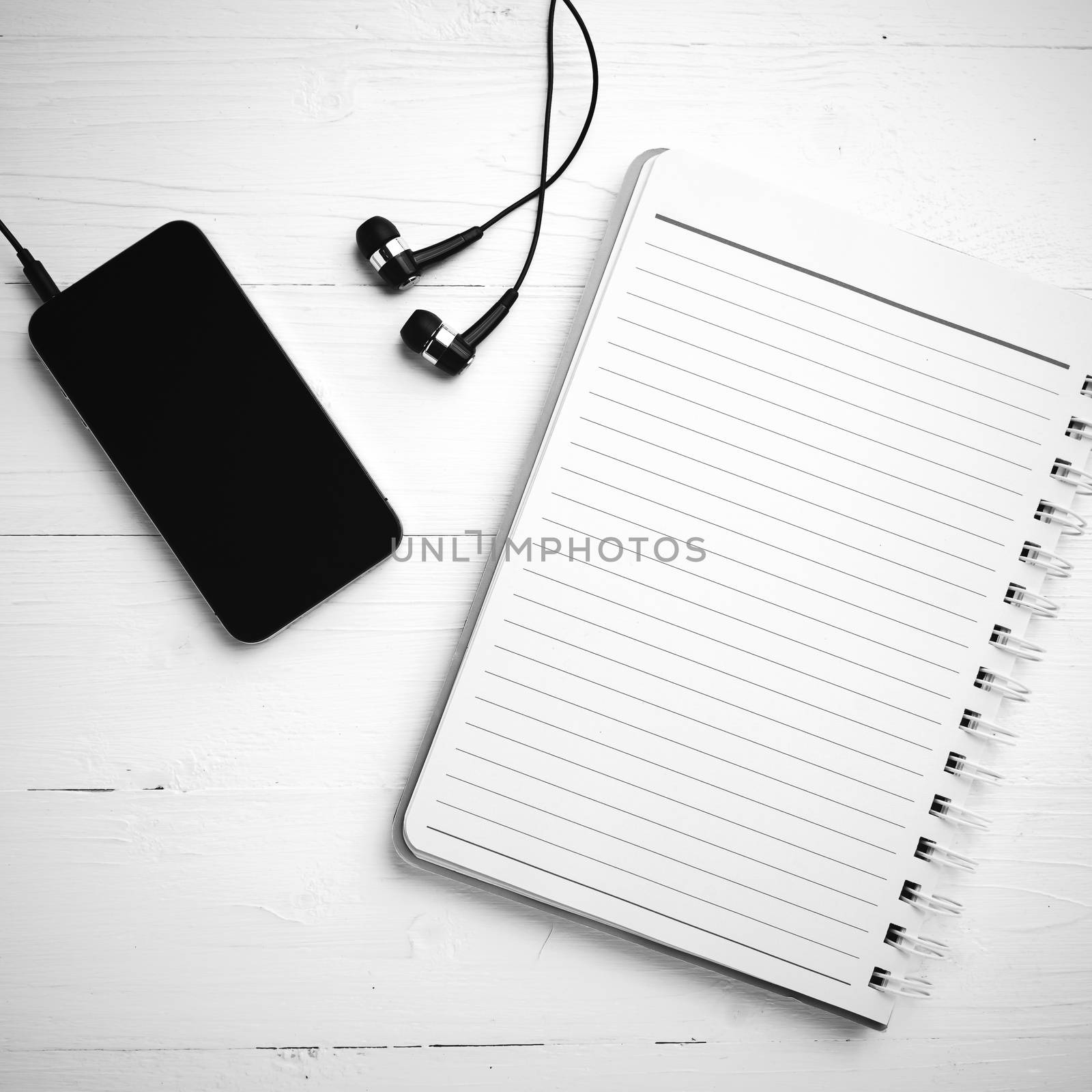 notepad and cellphone black and white color tone style  by ammza12