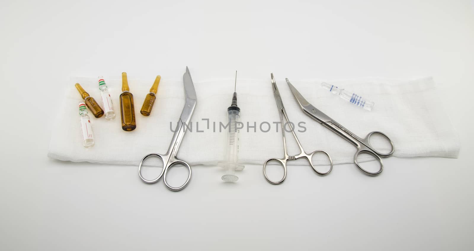 composition with surgical instruments, syringe and medicines