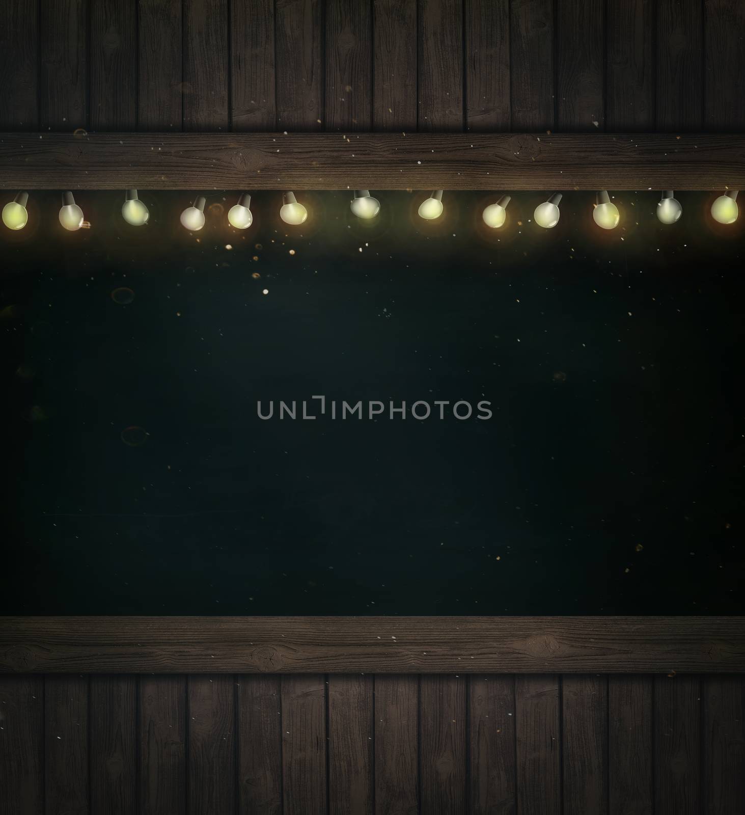 Christmas holiday lights on wooden blackboard