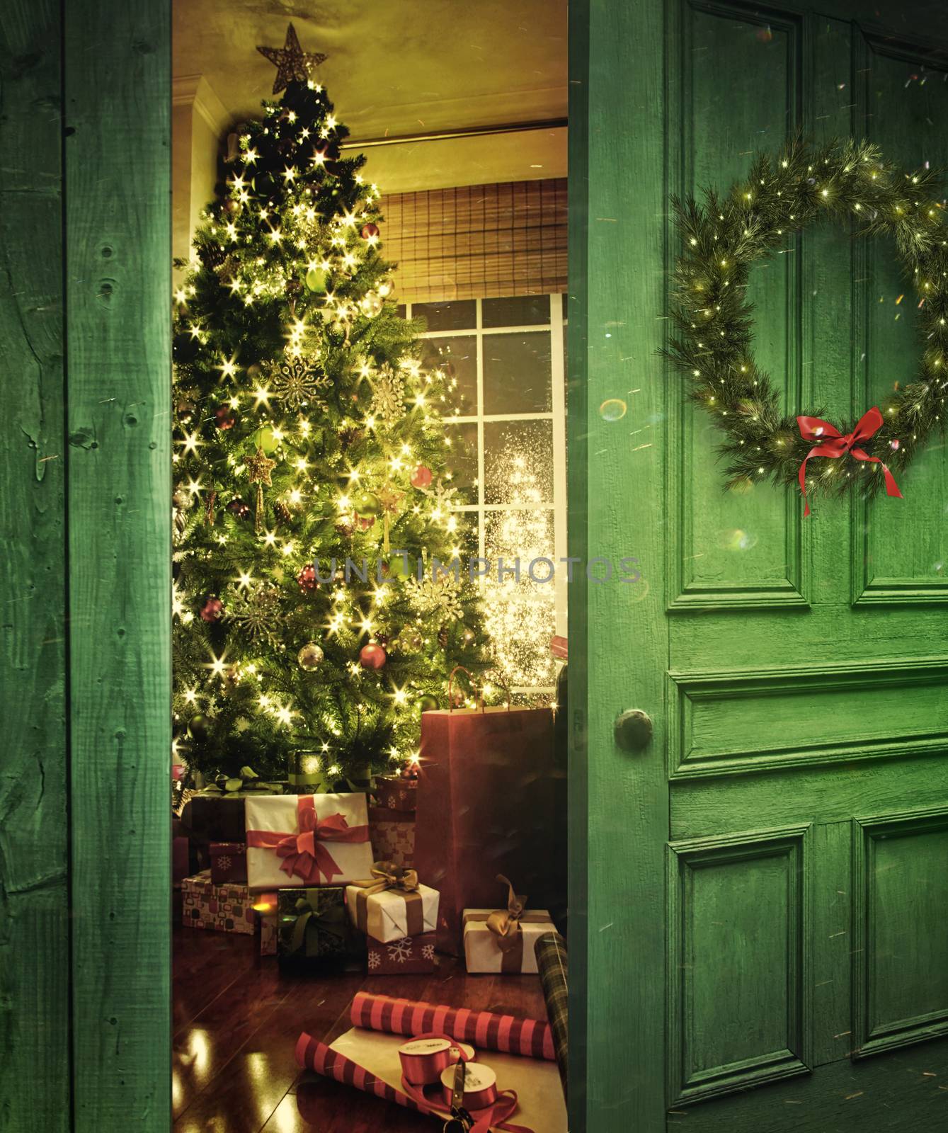 Rustic door opening into a room with Christmas tree