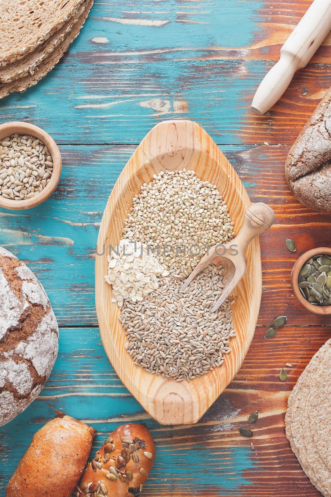 An assortment of whole grains and bread by Slast20