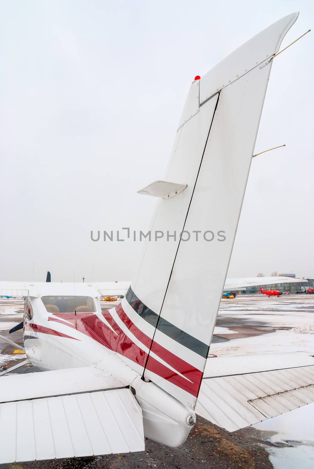 the tail of private plane at the airport is photographed close-up