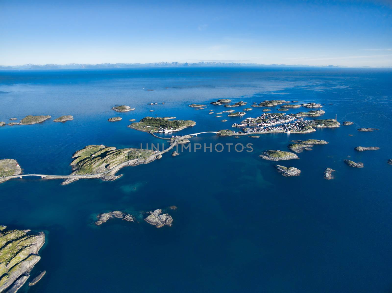 Aerial view of picturesque fishing port Henningsvaer on small islands in the sea