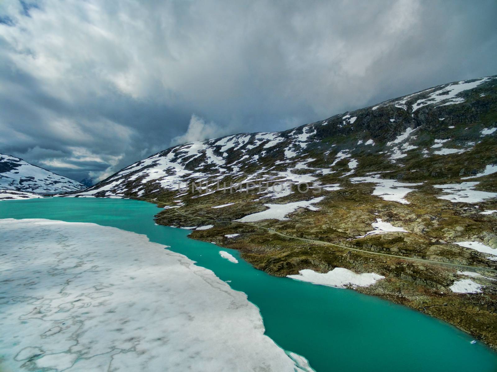 Frozen lake by Gamle Strynefjellsvegen national tourist road in Norway