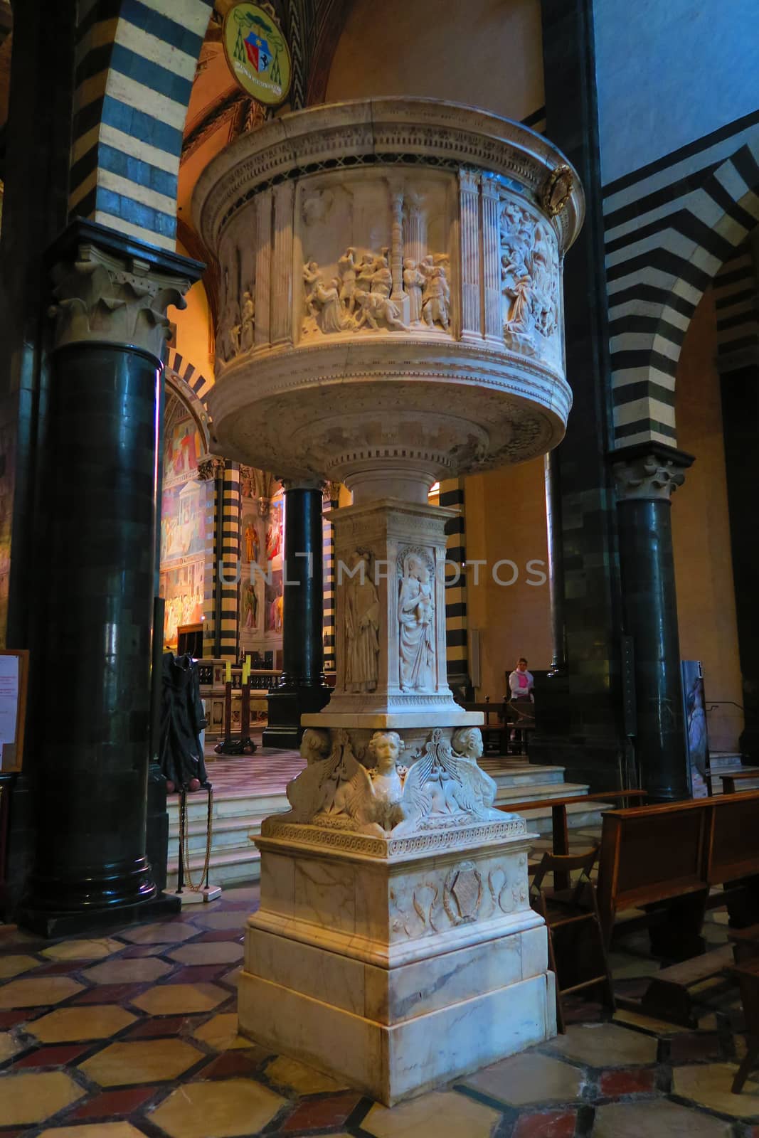 Prato,Italy,11 october 2015.Notable Renaissance pulpit in white marble (1469-1473). The base is decorated with sphinxes. The parapet has reliefs by Antonio Rossellino and by Mino da Fiesole. It is located in the Cathedral of Prato.