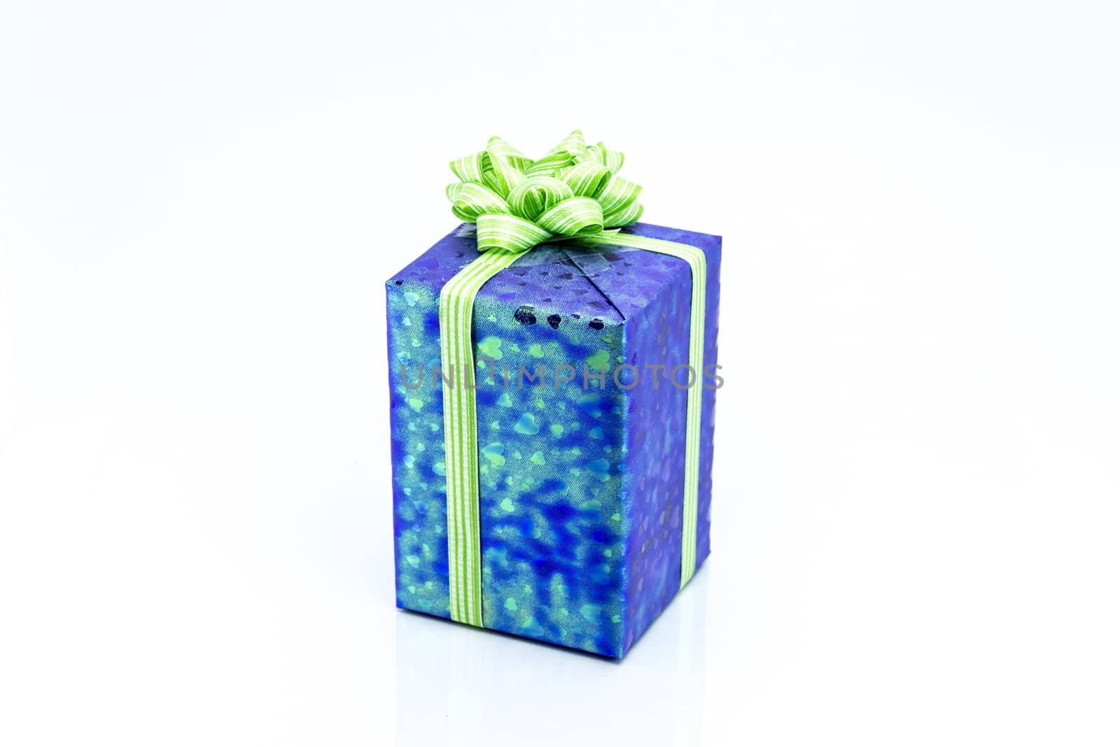 blue gift box with green ribbon bow, isolated on white