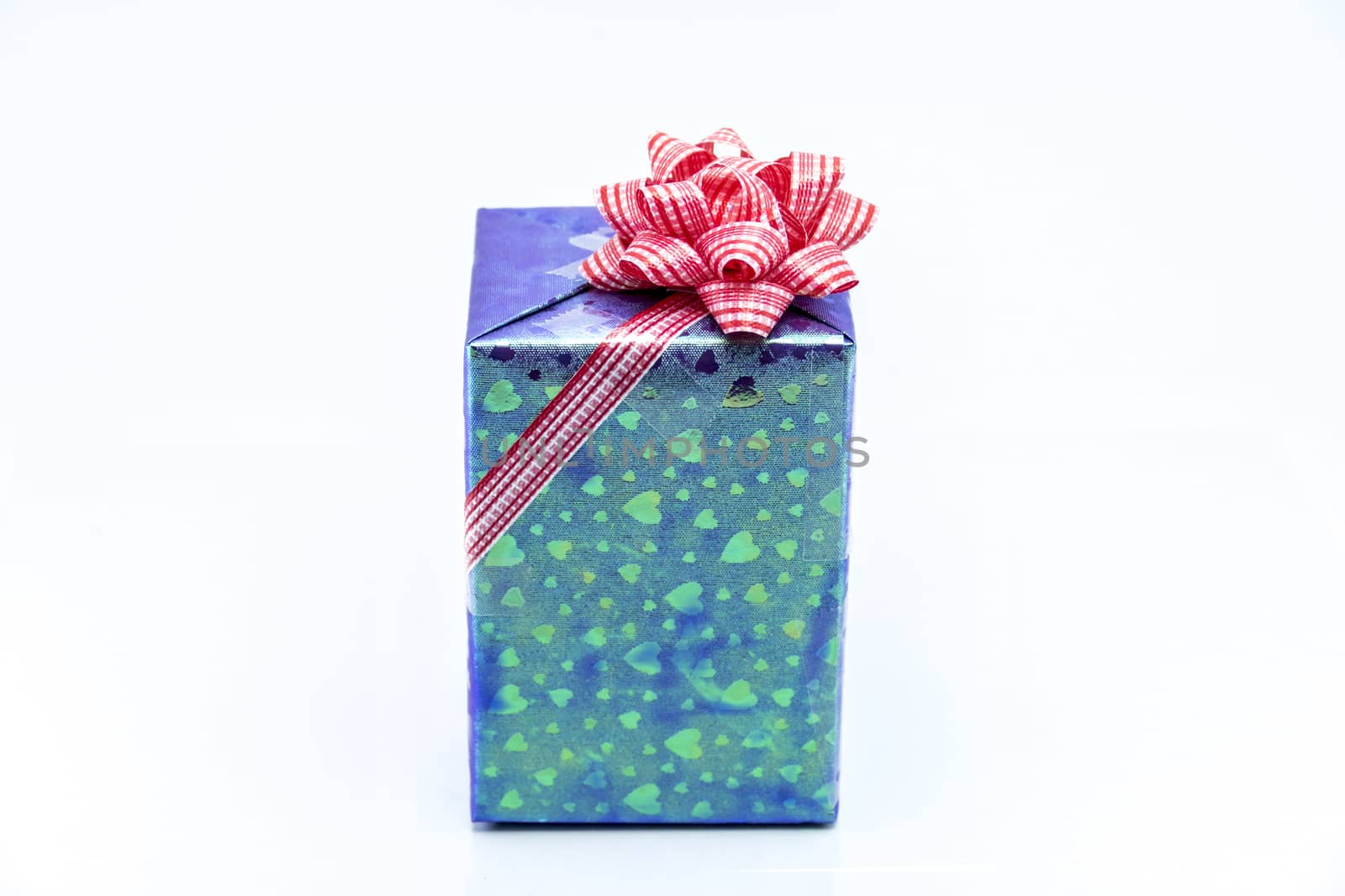 blue gift box with red ribbon bow by teerawit