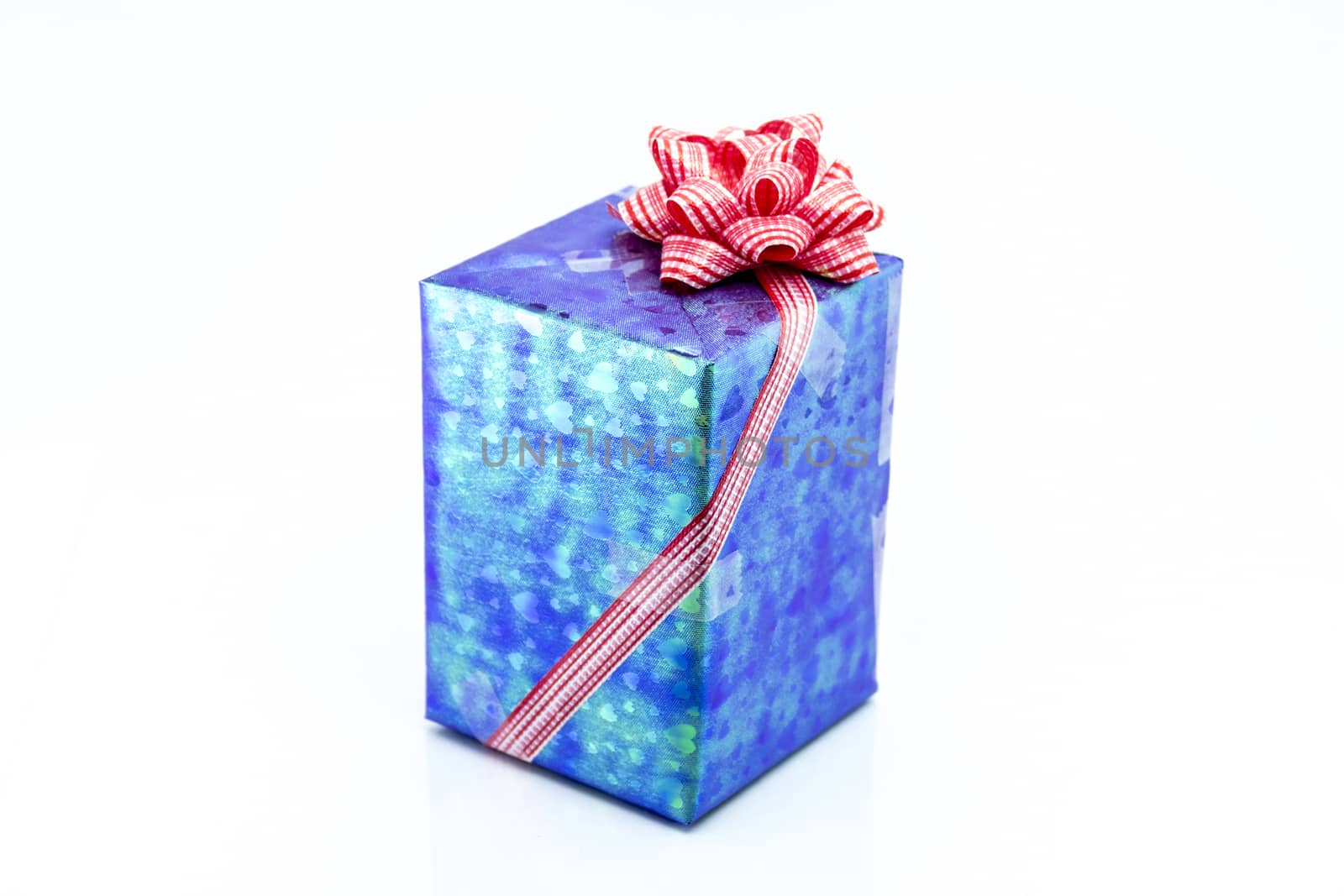 blue gift box with red ribbon bow by teerawit